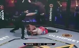 Russian dude hops the cage and attemps a flying headstomp to back his girl getting headlocked