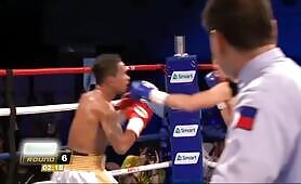 WBO Bantamweight Champion John Riel Casimero throws a vicious lead uppercut in the southpaw stance to make the brave Kenya Yamashita stumble on the floor.